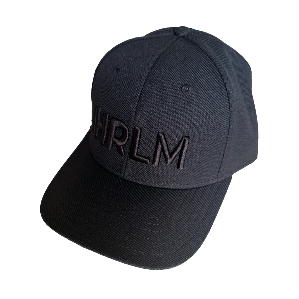Black cap with 'HRLM' text on a black background