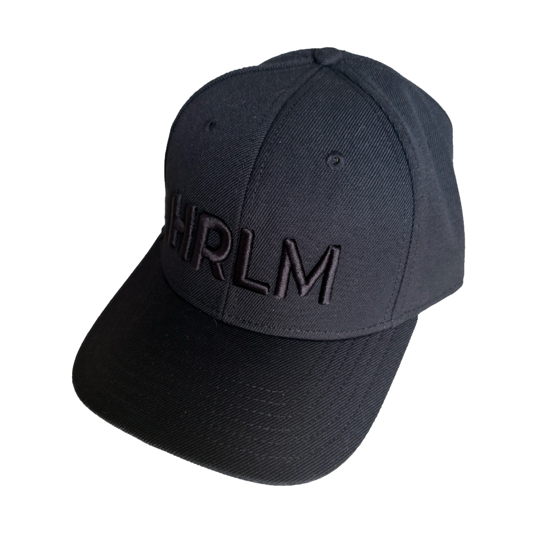 Black cap with 'HRLM' text on a black background