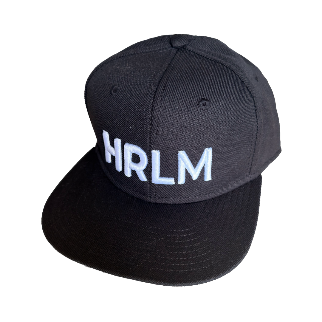 Black cap with 'HRLM' text on a white background